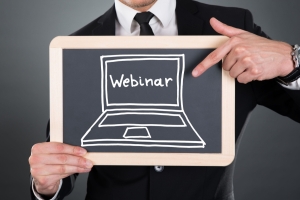 Chalkboard with a drawing of a computer and the word webinar written on It